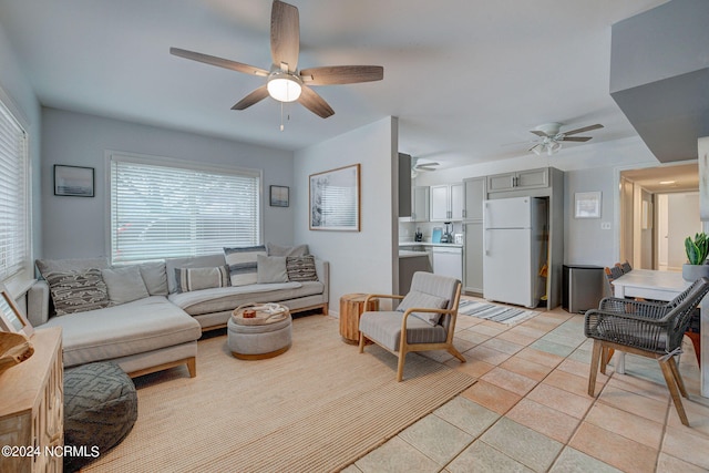 living room with plenty of natural light and ceiling fan