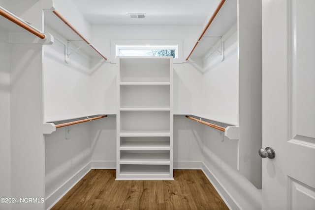 spacious closet featuring hardwood / wood-style floors