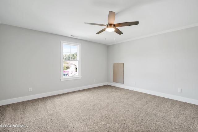 empty room featuring carpet floors and ceiling fan