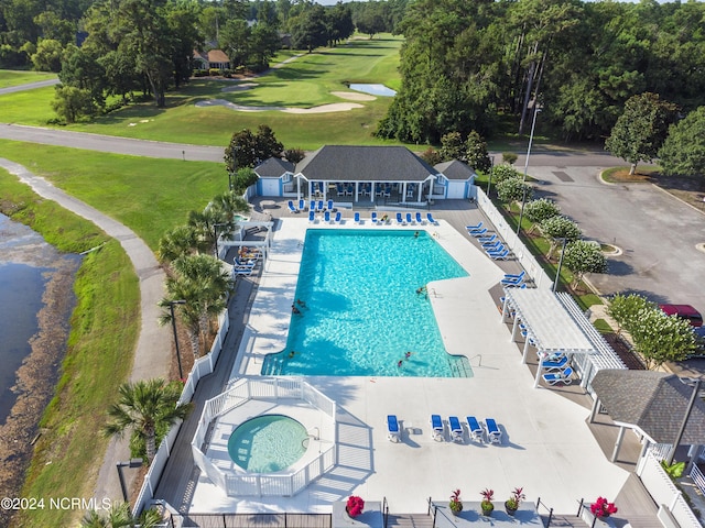 view of pool featuring a community hot tub and a patio