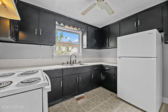 kitchen with white fridge, ceiling fan, sink, premium range hood, and light tile floors