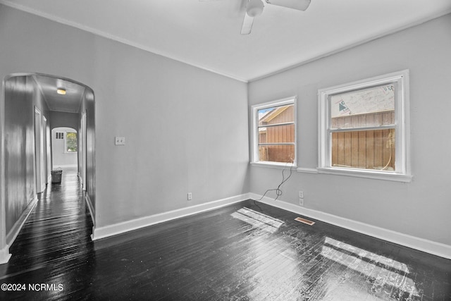 unfurnished room with ceiling fan and dark hardwood / wood-style floors