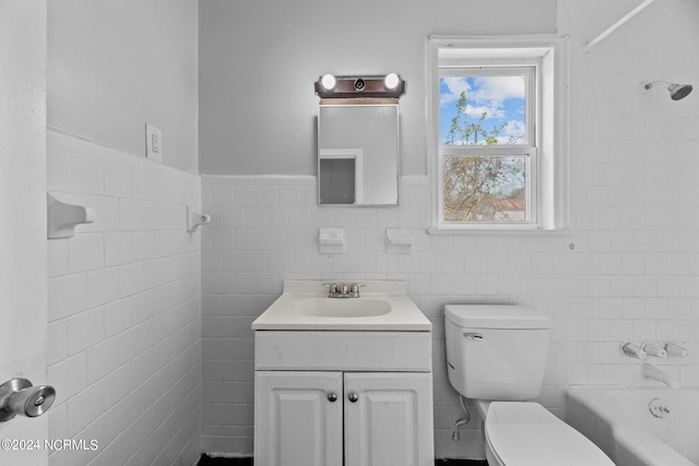 full bathroom with tile walls, shower / bath combination, toilet, and vanity