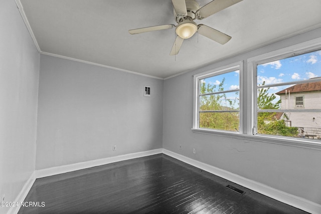 unfurnished room with crown molding, dark hardwood / wood-style flooring, and ceiling fan