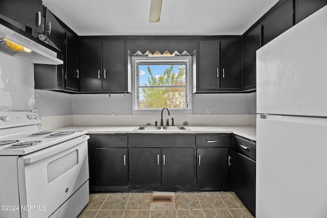 kitchen featuring fume extractor, light tile floors, white appliances, and sink