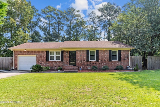 single story home featuring a garage and a front lawn