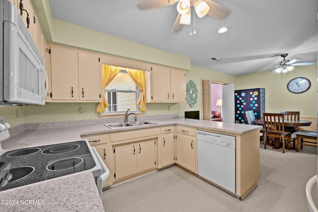 kitchen featuring ceiling fan, sink, white appliances, and kitchen peninsula