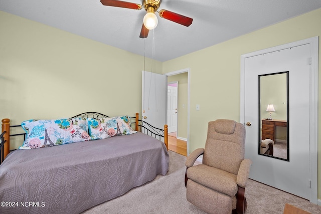 bedroom with ceiling fan and carpet