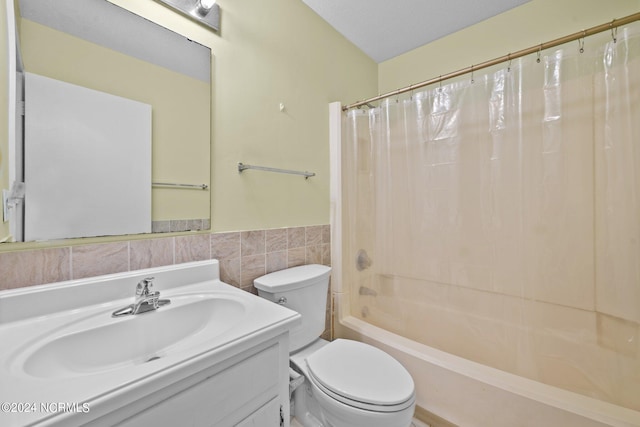 full bathroom featuring toilet, tile walls, shower / bath combination with curtain, decorative backsplash, and vanity