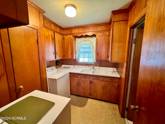 kitchen featuring separate washer and dryer and sink