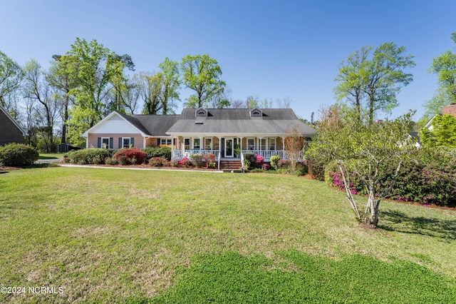 view of front of home featuring a front lawn and covered porch