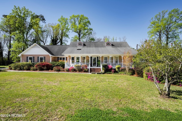 view of front of property with a front yard and a porch