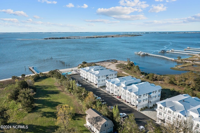 birds eye view of property with a water view