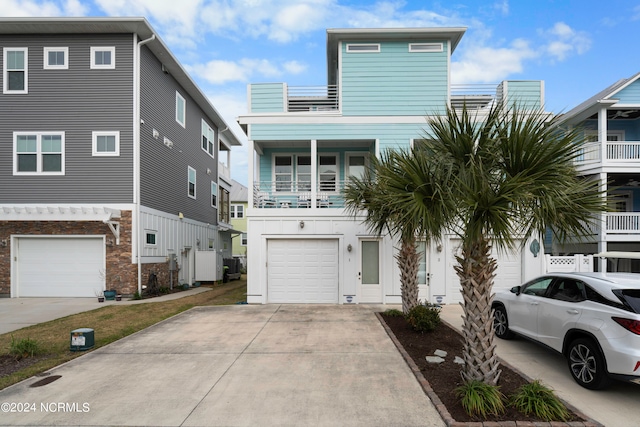 view of front of property featuring a balcony and a garage