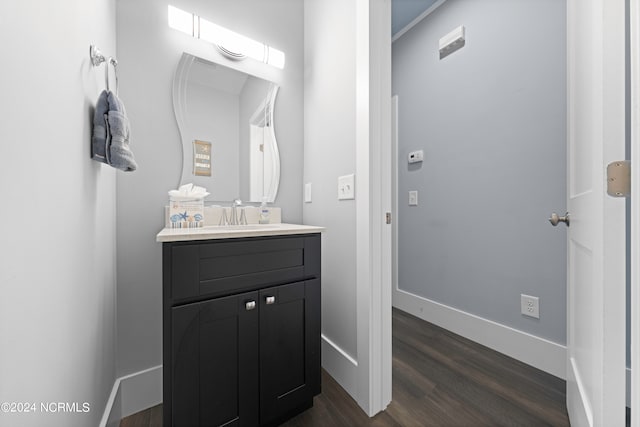 bathroom with vanity and hardwood / wood-style flooring