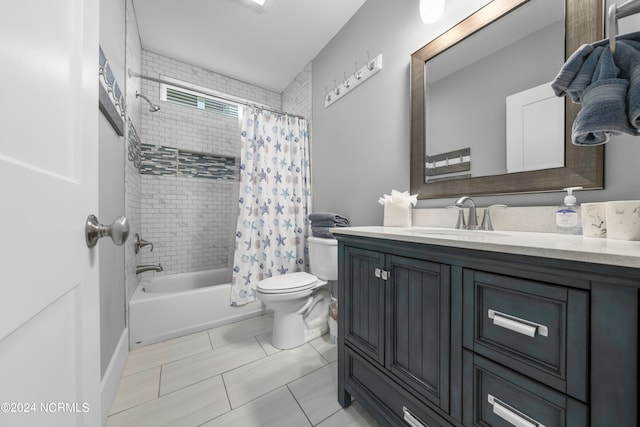 full bathroom with vanity, tile flooring, shower / tub combo with curtain, and toilet