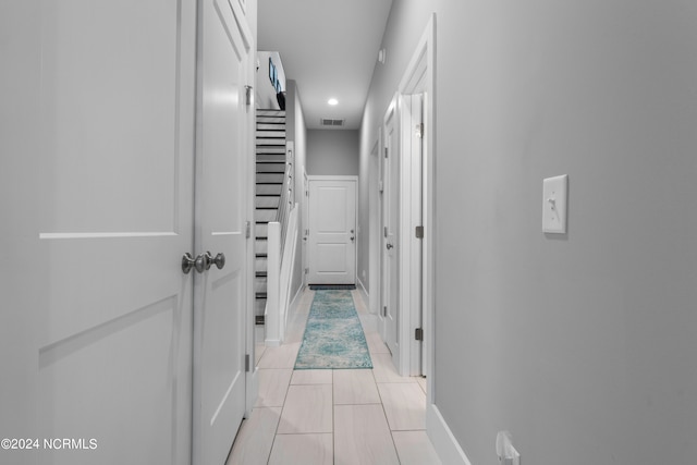 hallway with light tile flooring