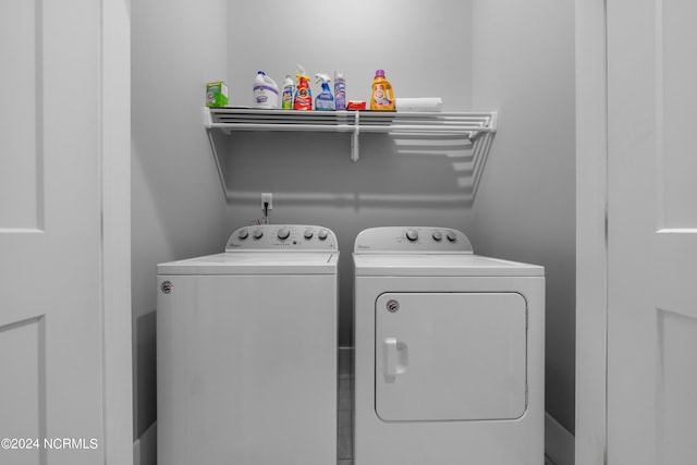 laundry room with washing machine and clothes dryer