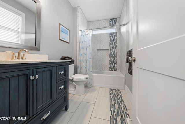 full bathroom with toilet, shower / bath combo with shower curtain, vanity, and tile flooring