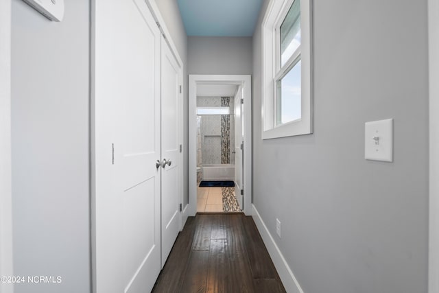 corridor featuring dark hardwood / wood-style floors