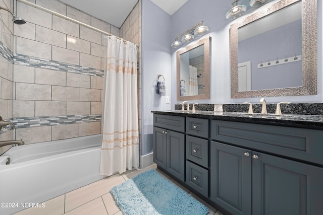 bathroom featuring double sink vanity, tile floors, and shower / bath combo with shower curtain