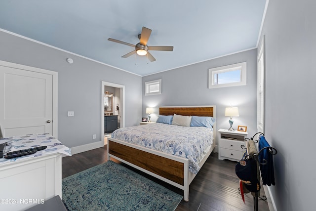 bedroom with ceiling fan, ornamental molding, connected bathroom, and dark hardwood / wood-style floors