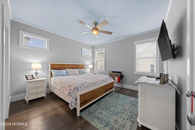 bedroom with ceiling fan, ornamental molding, and dark hardwood / wood-style floors