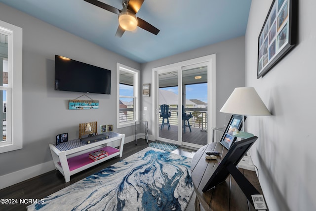 sitting room featuring ceiling fan and dark hardwood / wood-style flooring