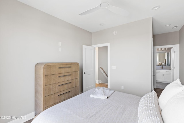 bedroom featuring ceiling fan, ensuite bathroom, and wood-type flooring