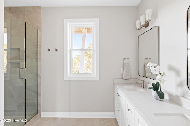 bathroom with an enclosed shower and vanity