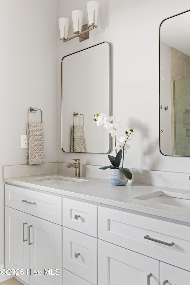 bathroom with vanity and an enclosed shower