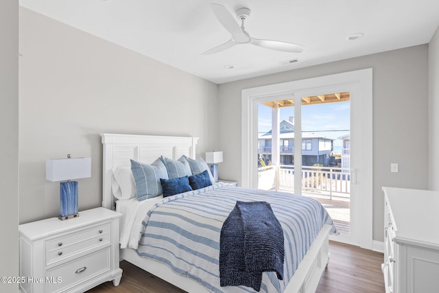 bedroom with access to outside, dark hardwood / wood-style floors, and ceiling fan