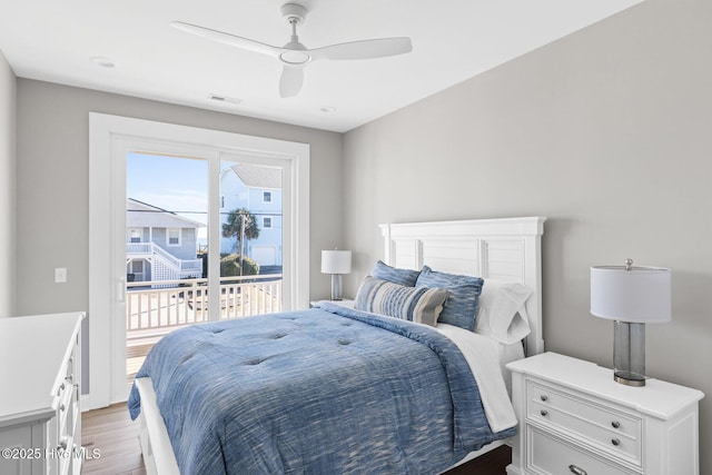 bedroom featuring access to exterior, ceiling fan, and light wood-type flooring