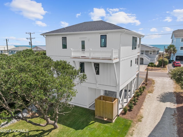 rear view of house featuring a balcony