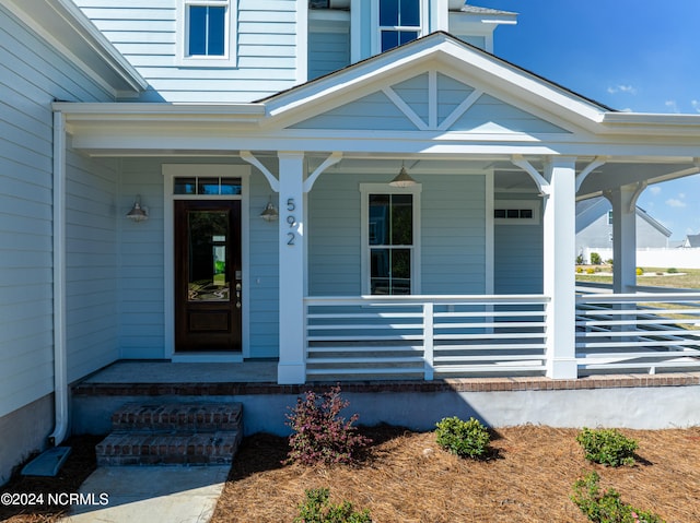 doorway to property with covered porch