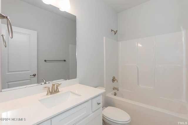 full bathroom with vanity, bathtub / shower combination, and toilet