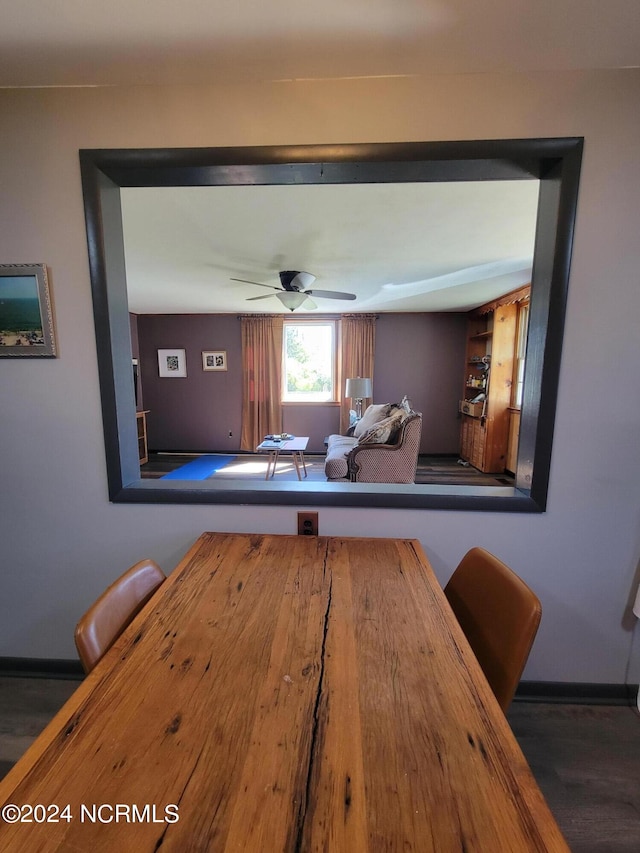 dining room featuring dark hardwood / wood-style flooring and ceiling fan