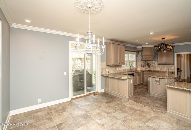 kitchen with pendant lighting, light stone counters, custom exhaust hood, an inviting chandelier, and backsplash