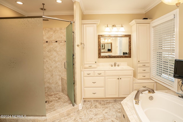 bathroom with ornamental molding, vanity, and separate shower and tub