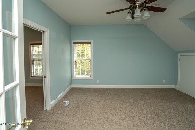 bonus room with ceiling fan, vaulted ceiling, and carpet