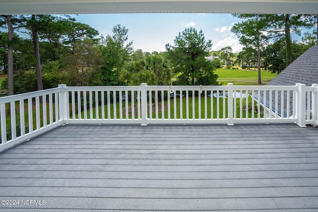 wooden deck with a yard