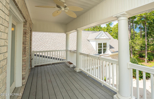 wooden deck featuring ceiling fan