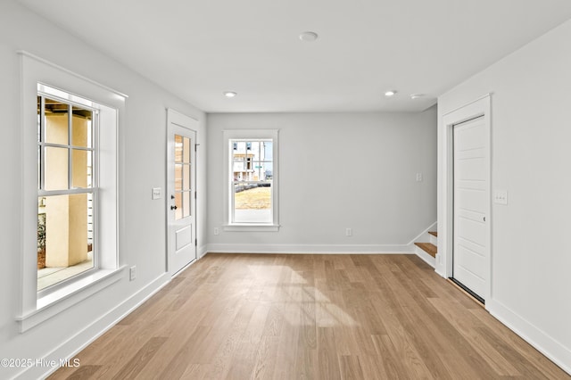 spare room featuring light hardwood / wood-style flooring