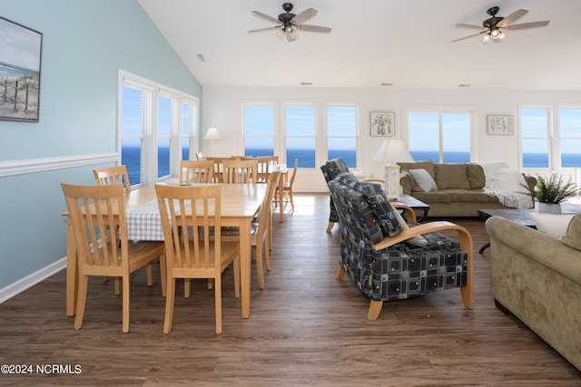 dining area featuring a water view, ceiling fan, and a wealth of natural light