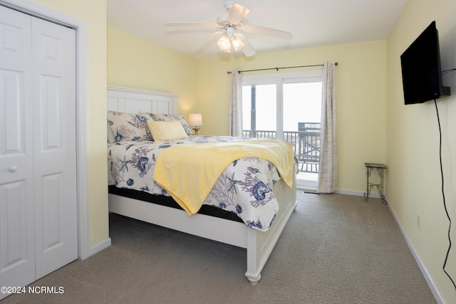 bedroom featuring dark carpet, a closet, and ceiling fan