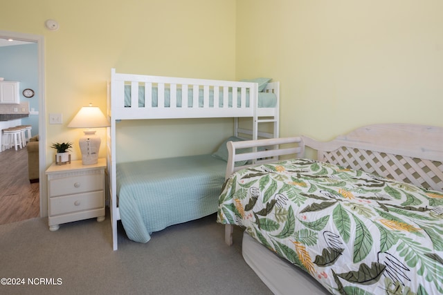 bedroom with dark carpet