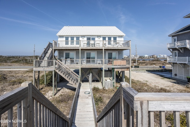 rear view of house with a balcony