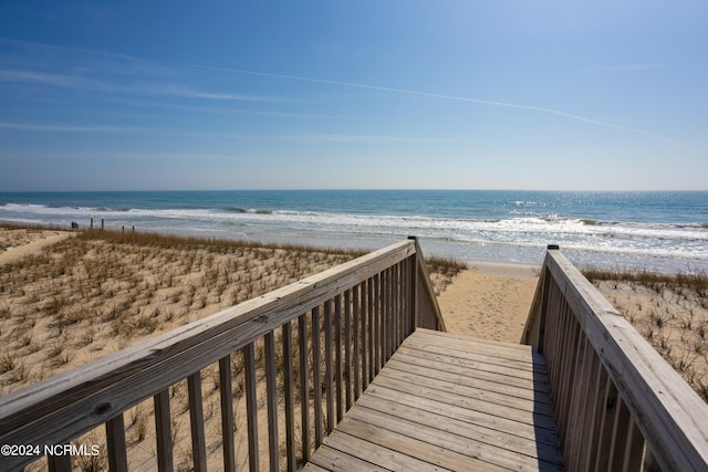 view of nearby features featuring a water view and a beach view