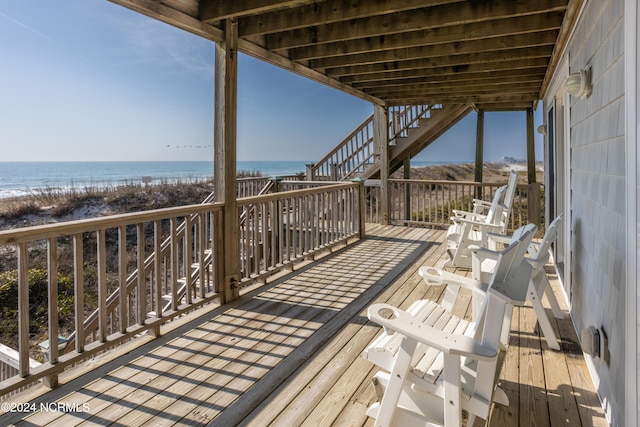 wooden deck featuring a water view