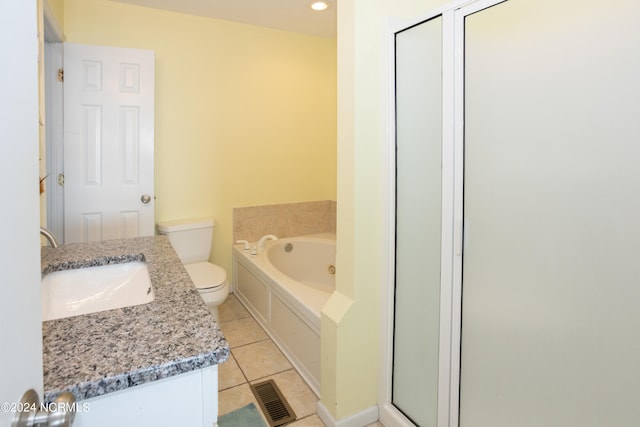 full bathroom featuring vanity, tile floors, toilet, and separate shower and tub